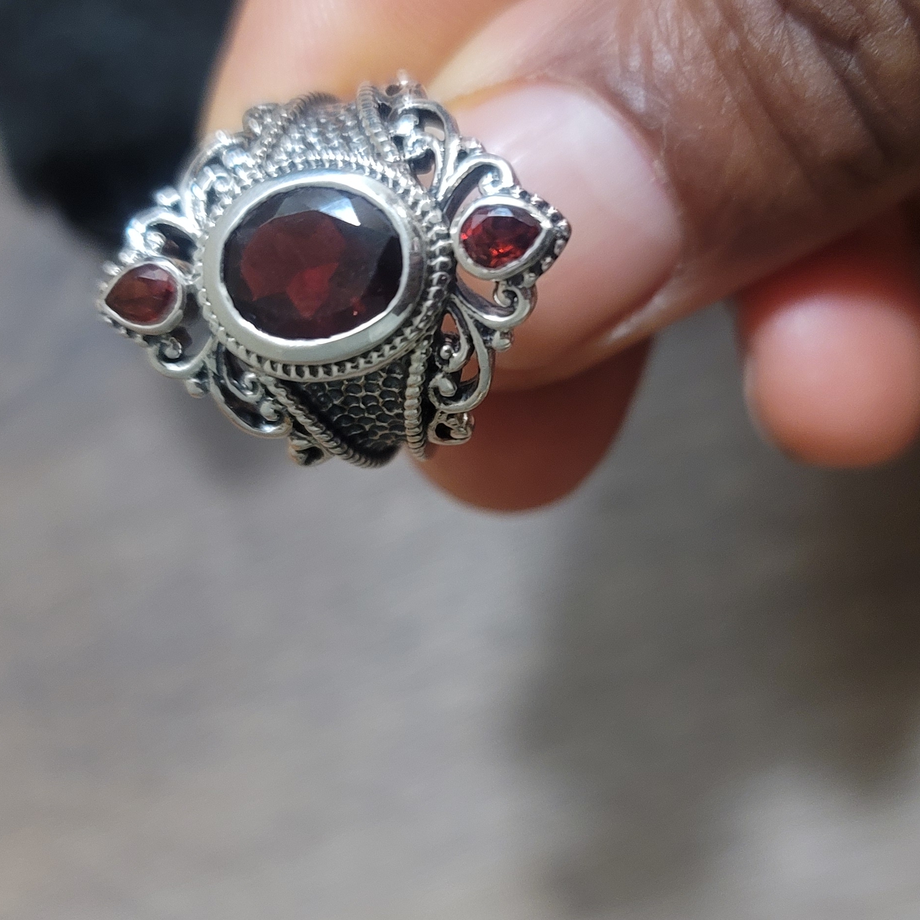 Ornate Silver And Ruby Gemstone Ring With Intricate Design